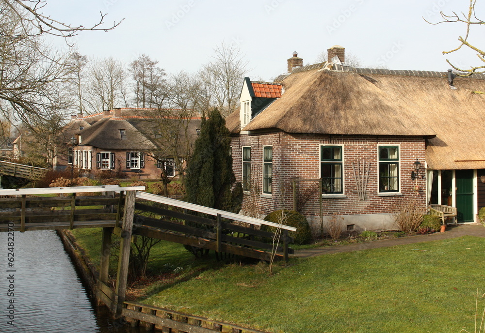 House and wooden bridge in Giethoorn House and wooden bridge in Giethoorn