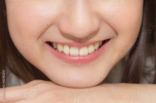 close-up Asian woman smiling with white teeth