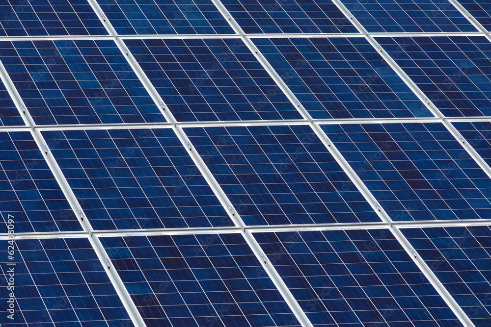 Angled view of solar panels on a sunny day Angled view of solar panels on a sunny day