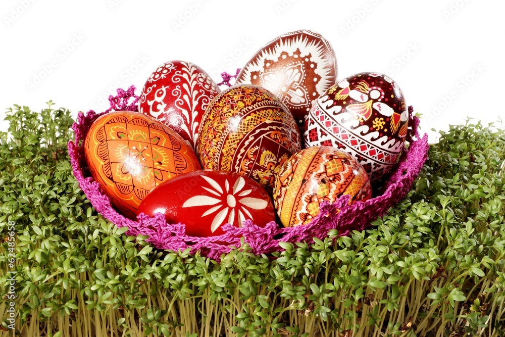Easter eggs in a nest on cuckooflower - obrazy, fototapety, plakaty 