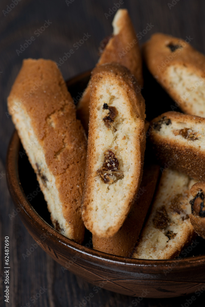 biscotti with raisins in a bowl, vertical biscotti with raisins in a bowl, vertical