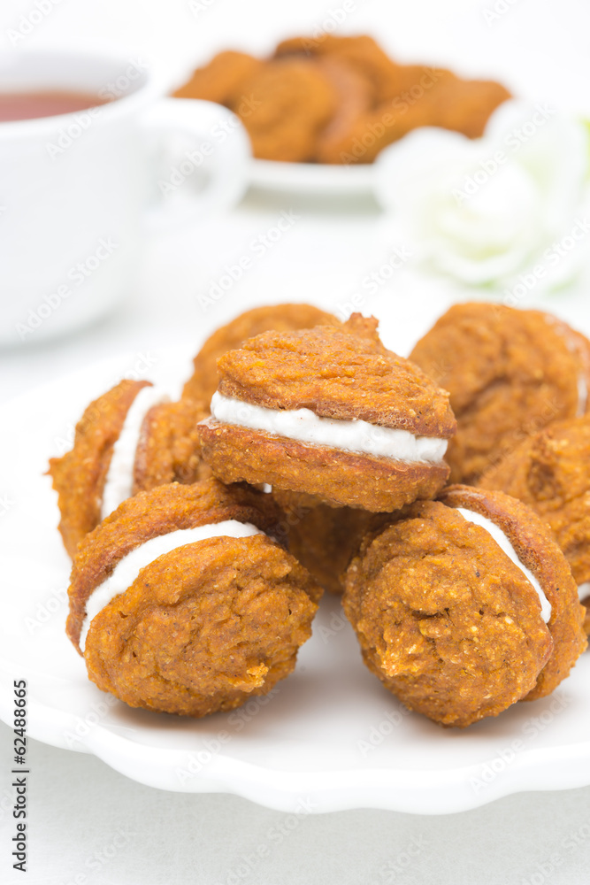 Pumpkin cookies with cream filling, close-up Pumpkin cookies with cream filling, close-up