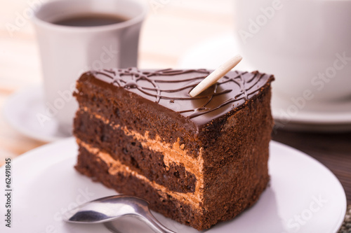 delicious chocolate cake and cup of coffee