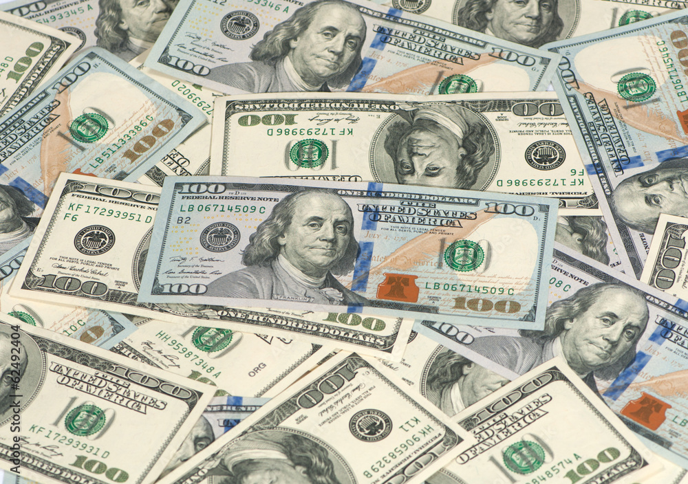 old and new hundred dollar bills in a pile old and new hundred dollar bills in a pile