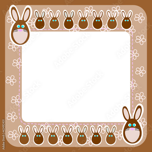 Chocolate Easter rabbits. Brown frame wth flowers. photo