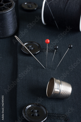 Sewing items selective focus on pin heads