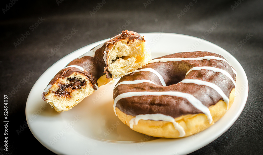 Chocolate donuts with a cup of coffee Chocolate donuts with a cup of coffee