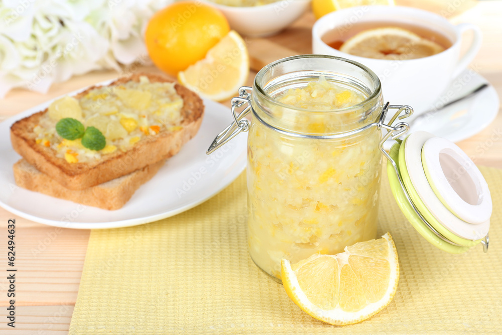 Delicious toasts with lemon jam on plate on table close-up Delicious toasts with lemon jam on plate on table close-up