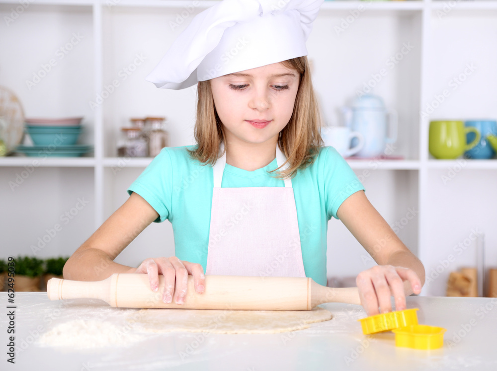 Little girl preparing cake dough in kitchen at home Little girl preparing cake dough in kitchen at home