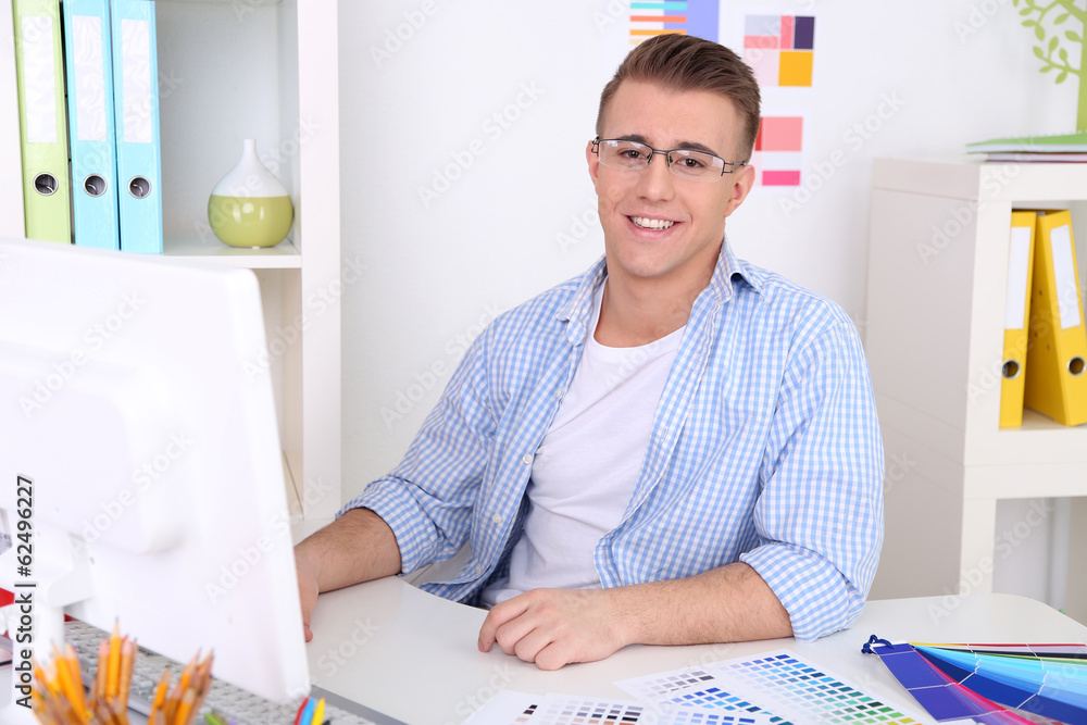 Young creative designer working at office Young creative designer working at office