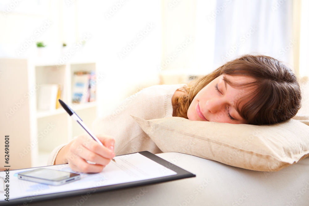 Young pretty girl sleeping while working home Young pretty girl sleeping while working home