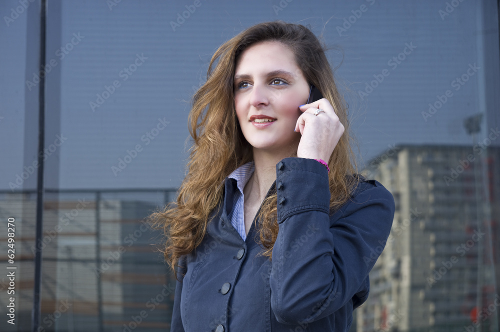 young business woman talking on the phone outdoors young business woman talking on the phone outdoors