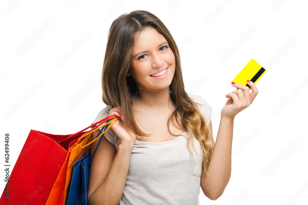 Woman holding shopping bags and a credit card Woman holding shopping bags and a credit card