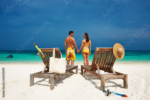 Couple in yellow on a beach at Maldives