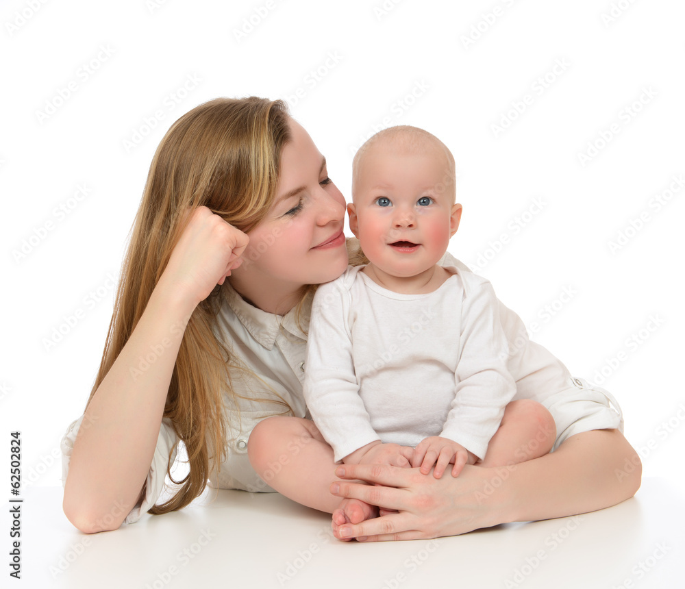 Young mother woman holding in her arms child baby kid Young mother woman holding in her arms child baby kid