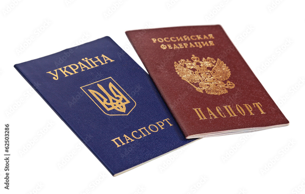 Ukrainian and Russian passports isolated on white background Ukrainian and Russian passports isolated on white background
