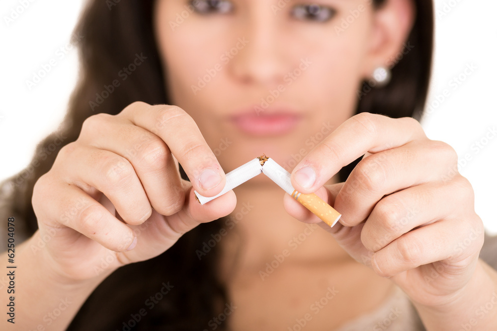 Woman breaking cigarette. concept stop smoking Woman breaking cigarette. concept stop smoking