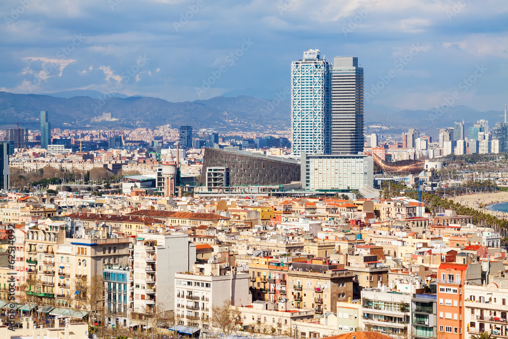 Fototapeta premium metropolitan area in cloudy day. Barcelona