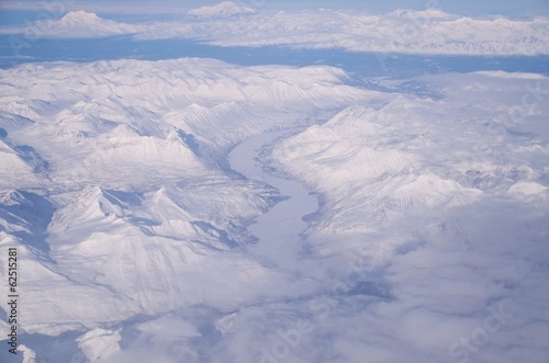 A Frozen River Running Through Ice And Snow In Alaska © kyrintethron