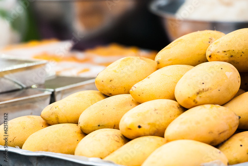 Selling yellow mango in market, Thailand