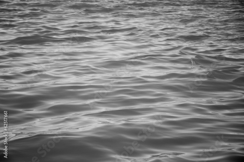 The surface of the ocean in black and white