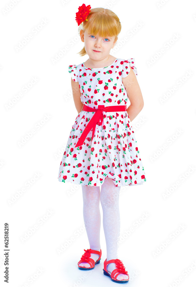 Charming little girl standing leg thrust forward and have fun lo Charming little girl standing leg thrust forward and have fun lo