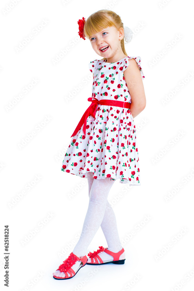 Charming little girl standing leg thrust forward and have fun lo Charming little girl standing leg thrust forward and have fun lo