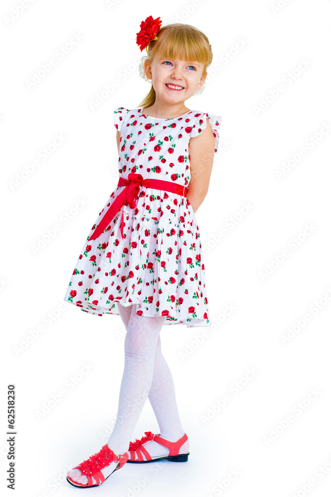 Charming little girl standing leg thrust forward and have fun lo Charming little girl standing leg thrust forward and have fun lo