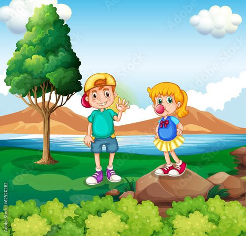 Two kids at the riverside