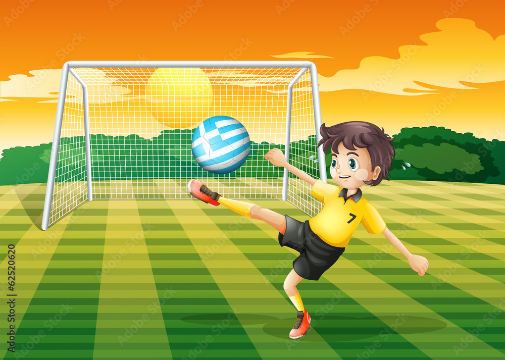 Fototapeta premium A female player kicking the ball with the flag of Greece