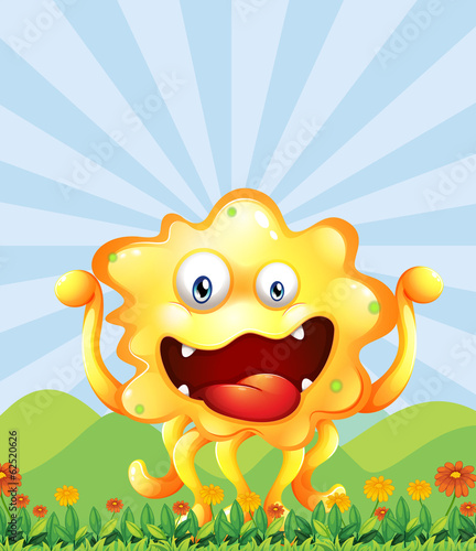 A yellow monster near the hills