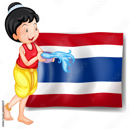 A smiling Thai woman in front of the Thailand flag