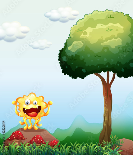 A smiling monster above the rock near the red mushrooms