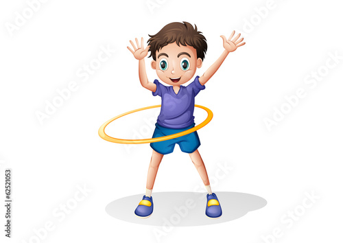A young man playing with the hulahoop