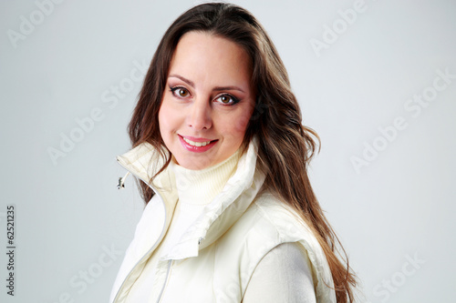 Portrait of a smiling woman over background photo