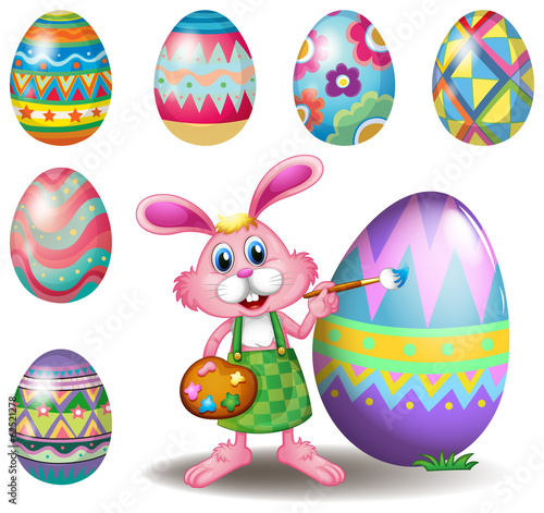A bunny painting the eggs