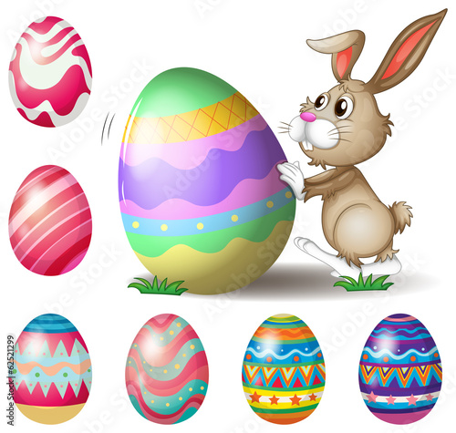 A bunny pushing a big Easter egg