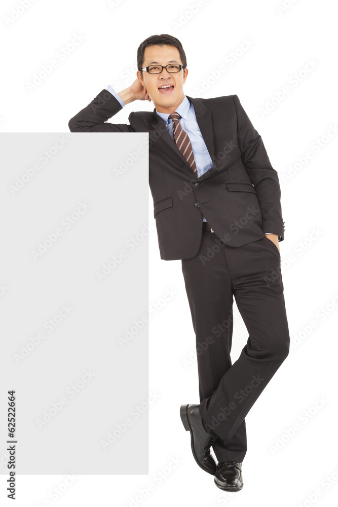 smiling businessman stand with blank wall smiling businessman stand with blank wall