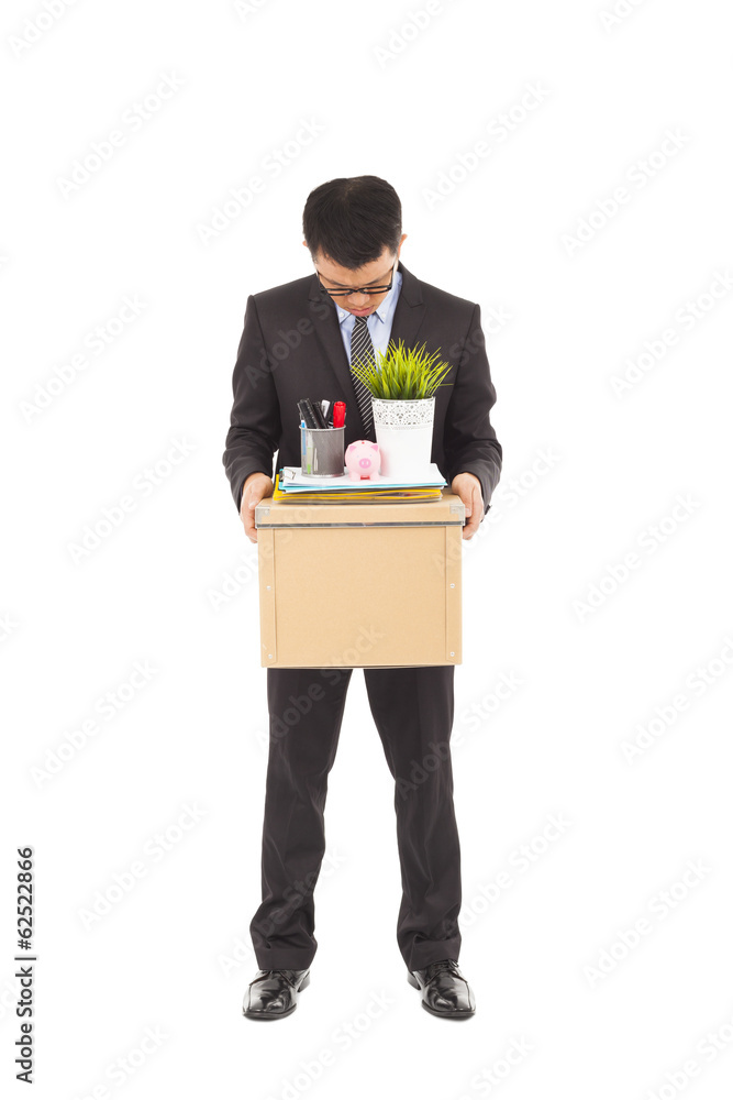 portrait of a fired businessman carrying a box portrait of a fired businessman carrying a box