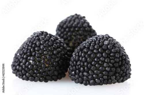 black candy berries isolated on white