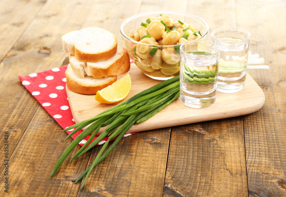 Composition with glasses of vodka and marinated mushrooms Composition with glasses of vodka and marinated mushrooms