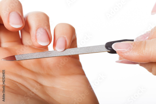 Hands with nailfile photo