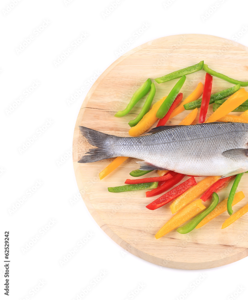 Fresh seabass fish on colorful pepper. Fresh seabass fish on colorful pepper.