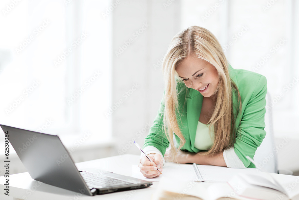 smiling student girl writing in notebook smiling student girl writing in notebook