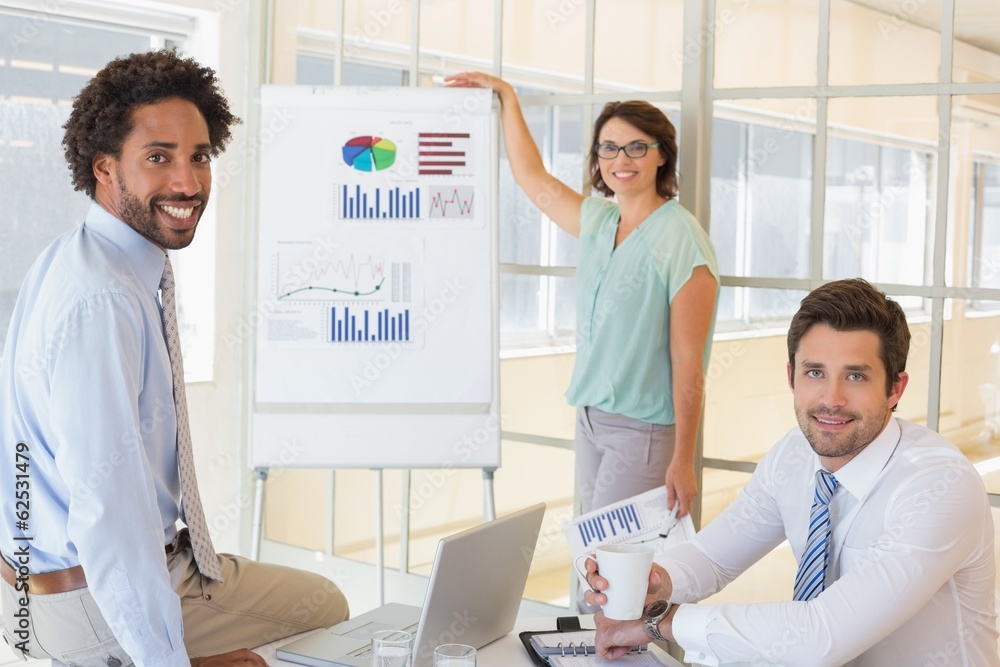Fototapeta premium Businesswoman giving presentation to colleagues in office