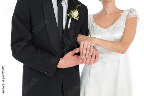 Loving couple showing wedding rings