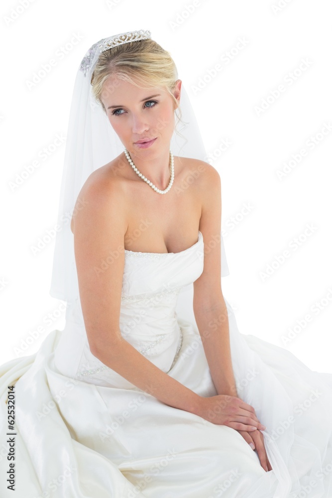 Thoughtful young bride in off shoulder dress Thoughtful young bride in off shoulder dress