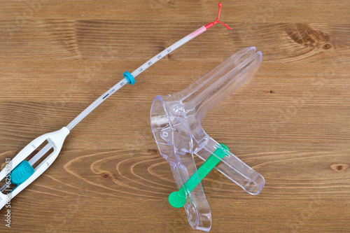 Speculum and an IUD