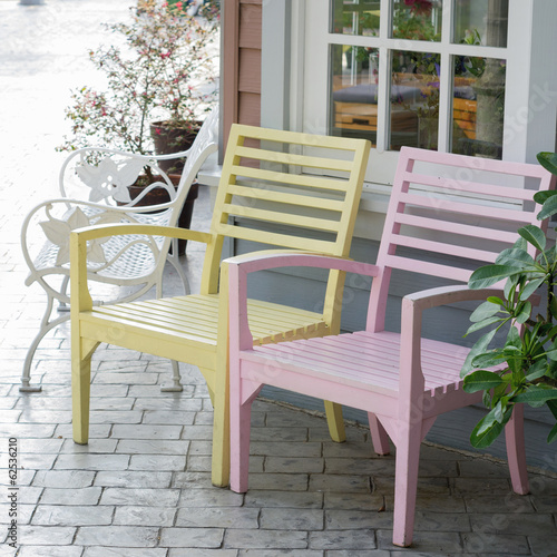 Pink and yellow wooden chair