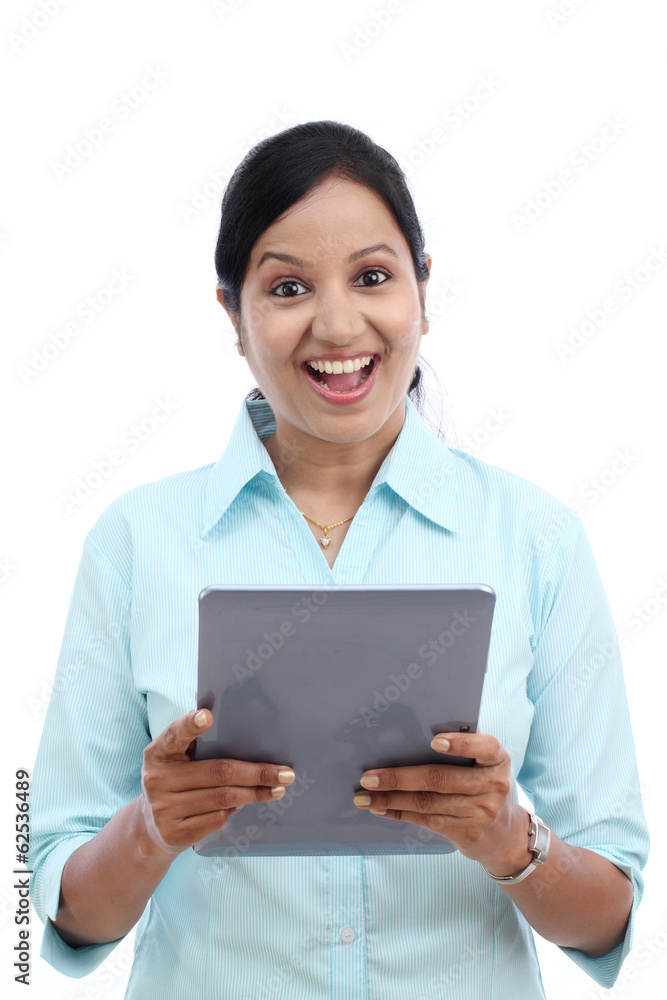 Young business woman looking at touch pad PC Young business woman looking at touch pad PC
